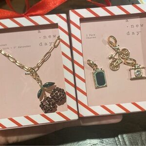 A New Day Gold Necklace and Charm Set